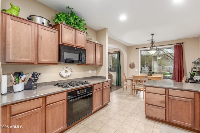 kitchen with arched walkways, light tile patterned flooring, black appliances, pendant lighting, and recessed lighting