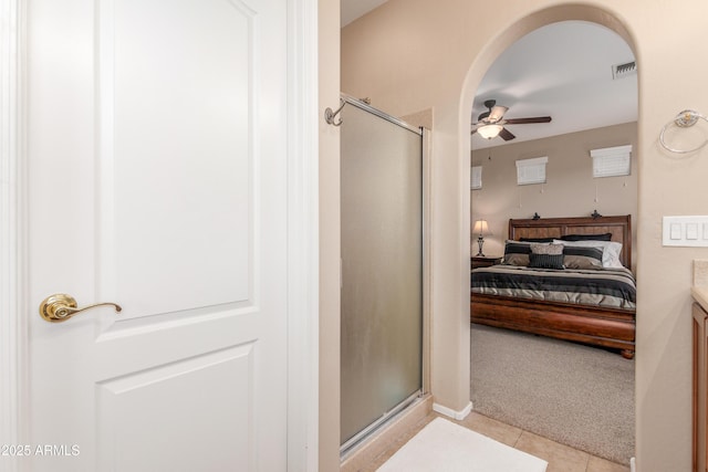 full bathroom with tile patterned floors, connected bathroom, visible vents, and a shower stall