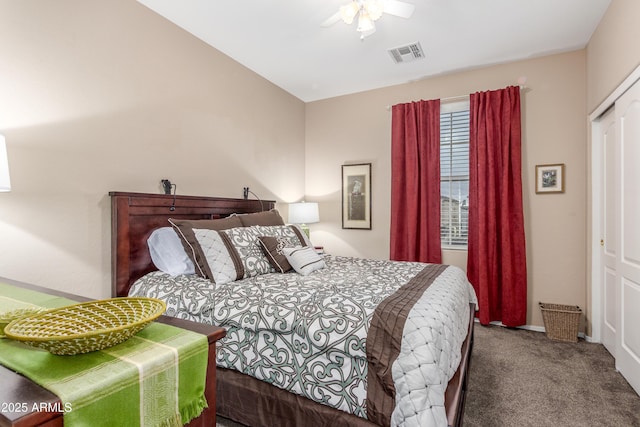 bedroom featuring carpet floors, ceiling fan, visible vents, and baseboards