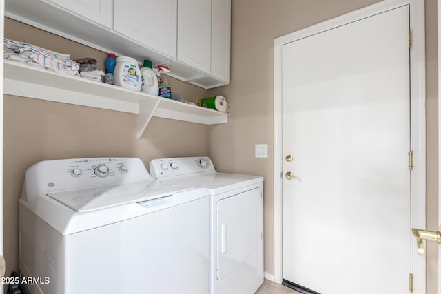 washroom with independent washer and dryer and cabinet space