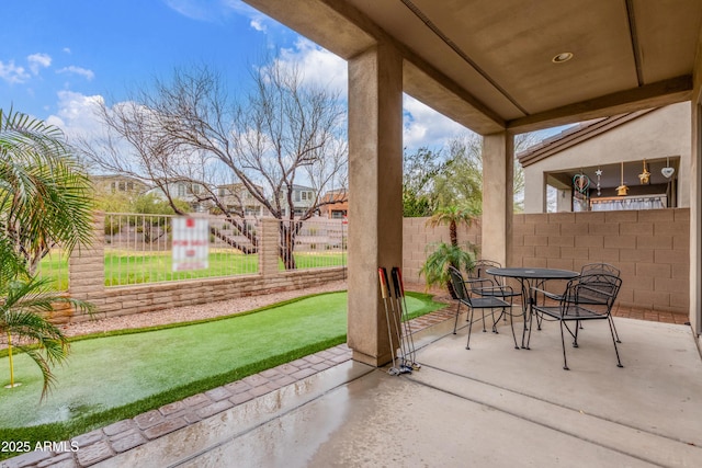 view of patio / terrace with outdoor dining area and a fenced backyard