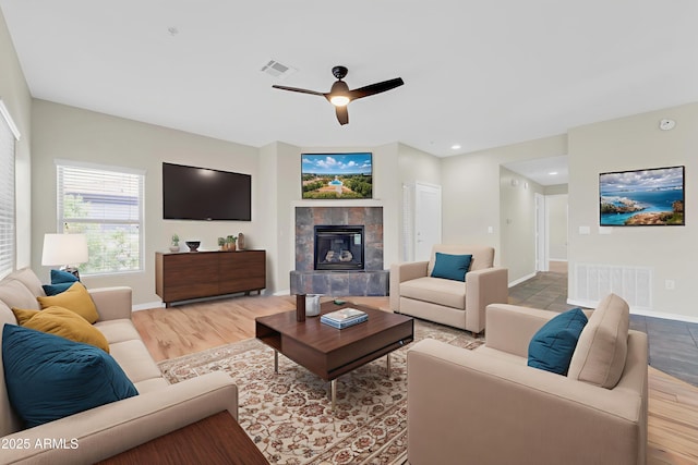 20121 N 76th St Unit 2021, Scottsdale, AZ 85255 - living area with a ceiling fan, baseboards, a tile fireplace, recessed lighting, and light wood-style floors