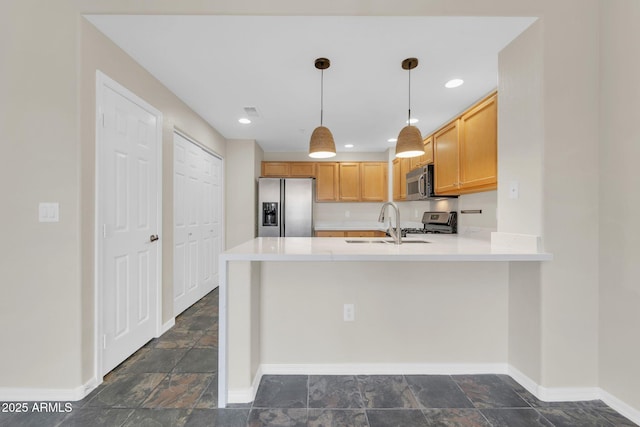 20121 N 76th St Unit 2021, Scottsdale, AZ 85255 - kitchen featuring appliances with stainless steel finishes, stone tile floors, a sink, a peninsula, and light countertops