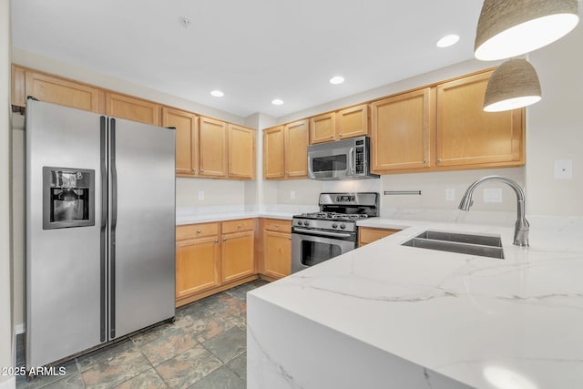 20121 N 76th St Unit 2021, Scottsdale, AZ 85255 - kitchen featuring appliances with stainless steel finishes, a sink, stone finish flooring, light stone countertops, and recessed lighting