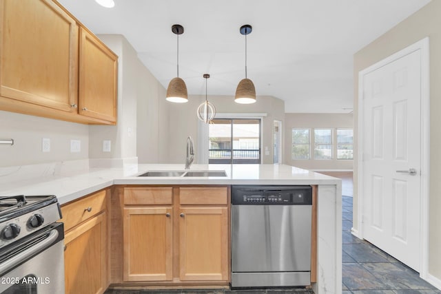 20121 N 76th St Unit 2021, Scottsdale, AZ 85255 - kitchen with stainless steel appliances, a sink, a peninsula, and hanging light fixtures