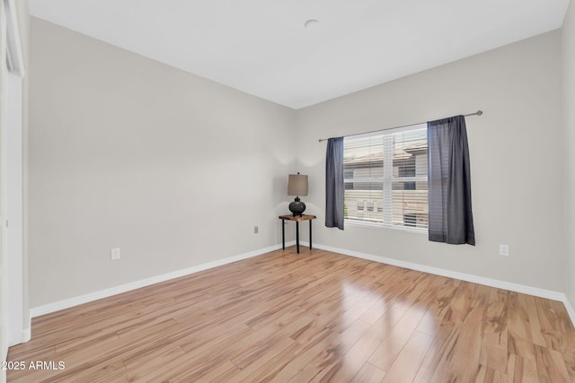 20121 N 76th St Unit 2021, Scottsdale, AZ 85255 - unfurnished room featuring wood finished floors and baseboards