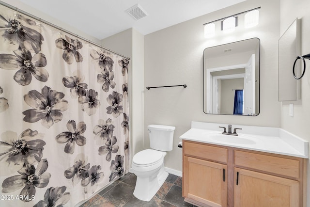20121 N 76th St Unit 2021, Scottsdale, AZ 85255 - full bathroom featuring toilet, vanity, stone tile floors, baseboards, and curtained shower