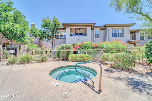 20121 N 76th St Unit 2021, Scottsdale, AZ 85255 - back of property with stucco siding, a hot tub, and a ceiling fan