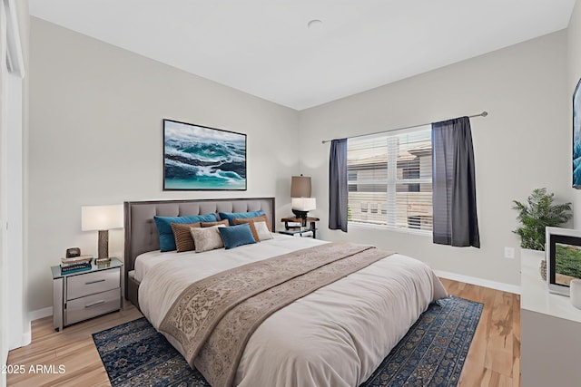 20121 N 76th St Unit 2021, Scottsdale, AZ 85255 - bedroom with light wood-type flooring and baseboards