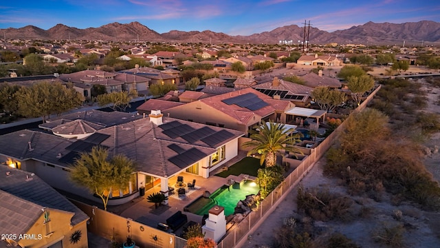 aerial view at dusk with a residential view and a mountain view