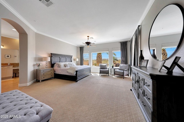 bedroom featuring arched walkways, light colored carpet, visible vents, baseboards, and ornamental molding