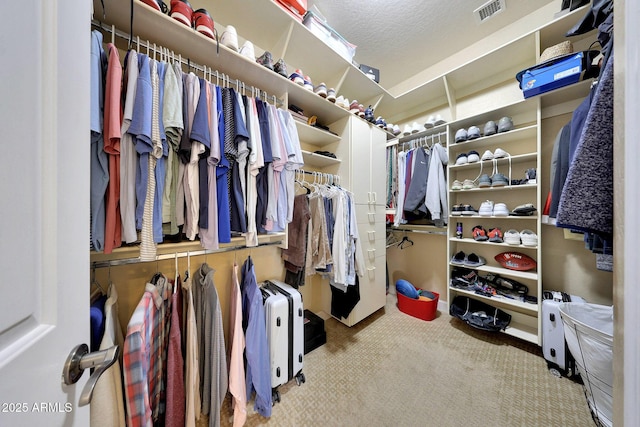 spacious closet featuring carpet floors and visible vents