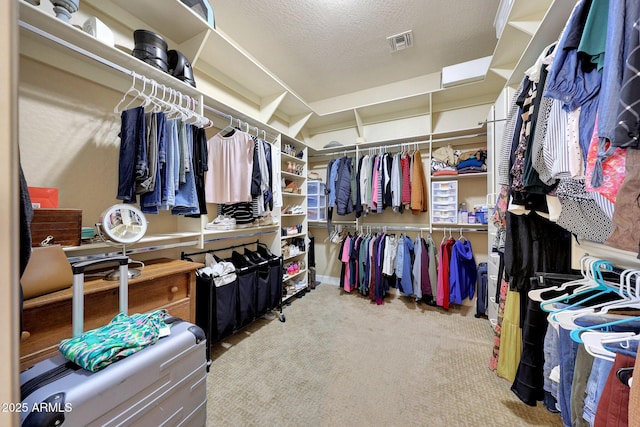 spacious closet with carpet and visible vents