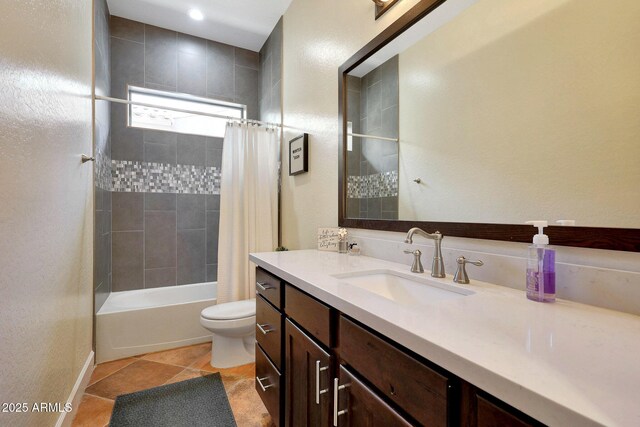 bathroom featuring toilet, tile patterned flooring, shower / bath combo, and vanity