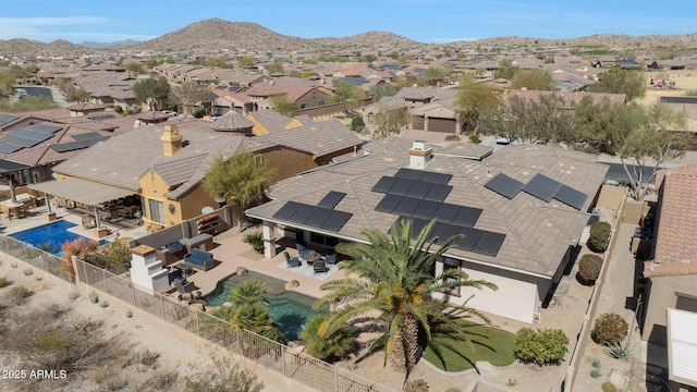 drone / aerial view with a residential view and a mountain view