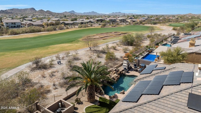 aerial view featuring a residential view, a mountain view, and golf course view