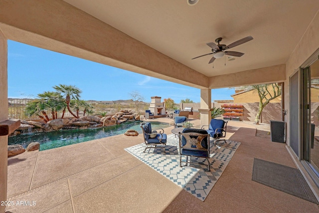 view of patio / terrace with a fenced in pool and a ceiling fan