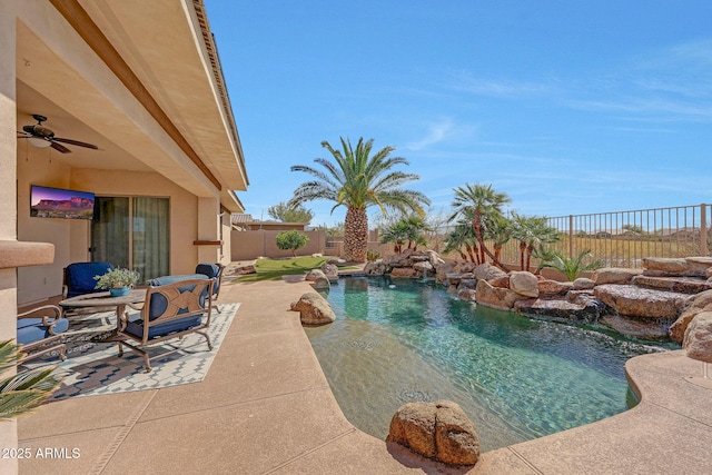 view of swimming pool with a patio area, a fenced backyard, a ceiling fan, and a fenced in pool