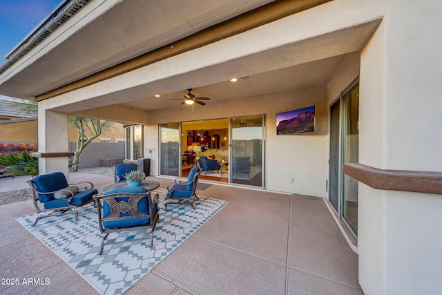 view of patio featuring a ceiling fan