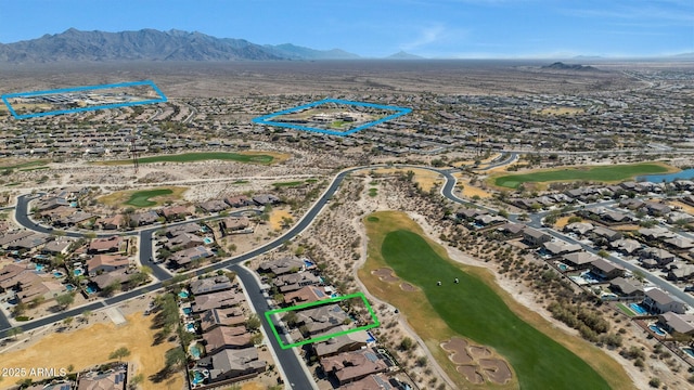 bird's eye view featuring view of golf course and a mountain view