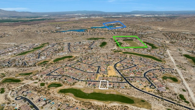 birds eye view of property with a mountain view