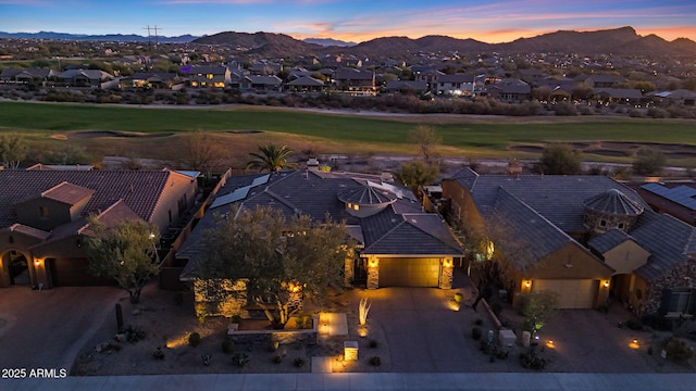 aerial view at dusk with a residential view and a mountain view