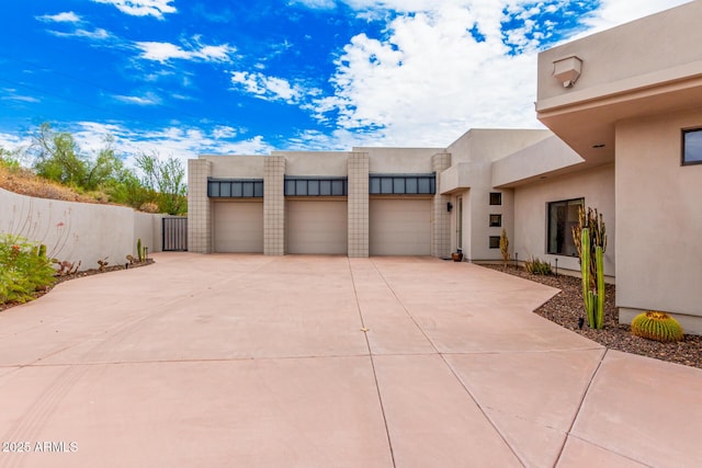 15332 E Hidden Springs Trl, Fountain Hills, AZ 85268 - view of front of home with a garage, driveway, and stucco siding
