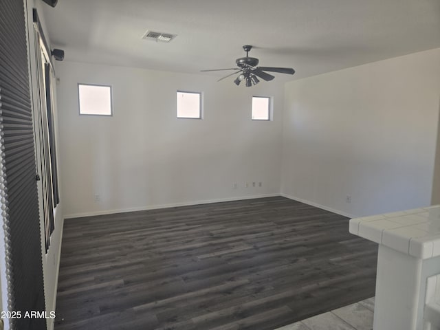 955 W Laurel Ave, Gilbert, AZ 85233 - spare room with a ceiling fan, plenty of natural light, and dark wood finished floors