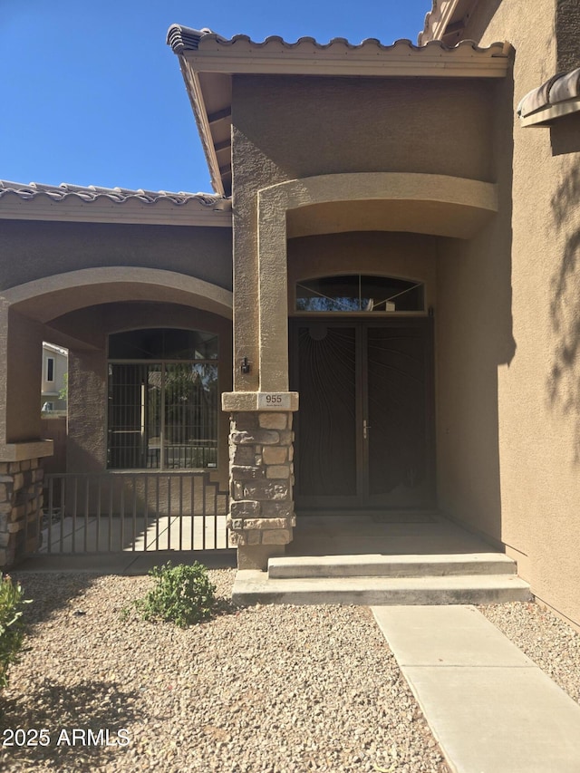 955 W Laurel Ave, Gilbert, AZ 85233 - view of exterior entry with stucco siding and french doors