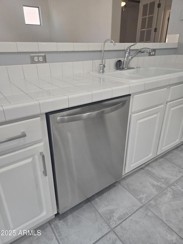 955 W Laurel Ave, Gilbert, AZ 85233 - kitchen with stainless steel dishwasher, white cabinets, tile countertops, and light tile patterned floors