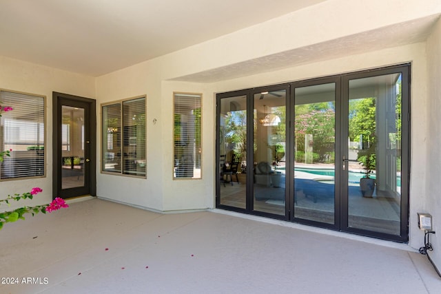 property entrance featuring a patio