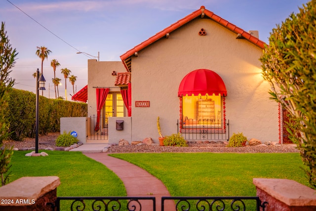 mediterranean / spanish-style house featuring a yard