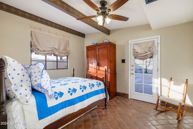 bedroom with beamed ceiling and ceiling fan