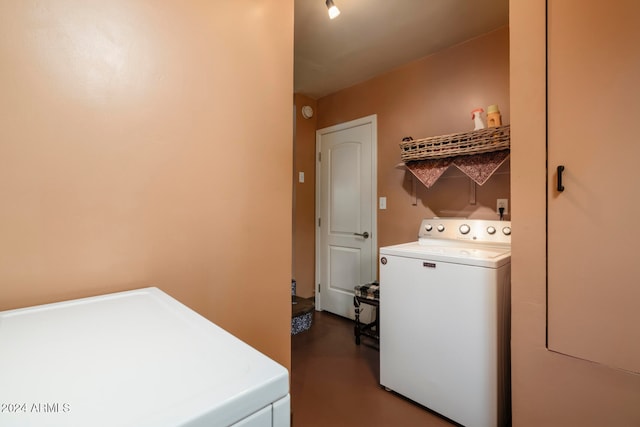 clothes washing area featuring independent washer and dryer