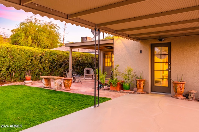 patio terrace at dusk with a yard