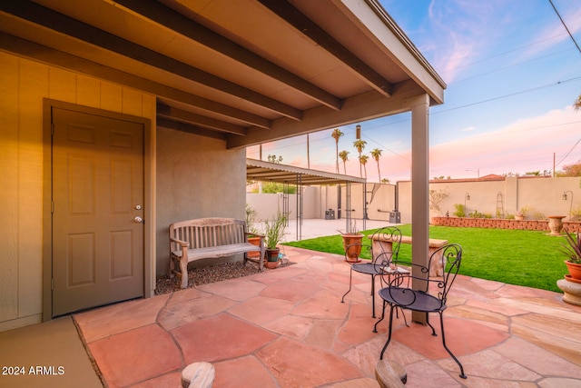 patio terrace at dusk with a lawn