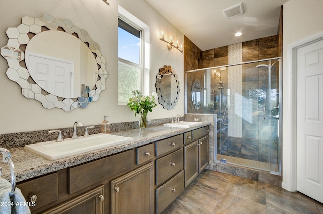 bathroom featuring vanity and an enclosed shower