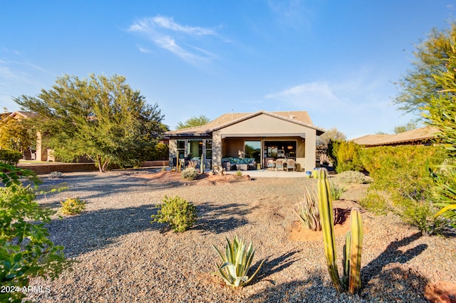 back of property with a patio area