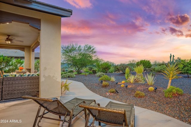 patio terrace at dusk with ceiling fan