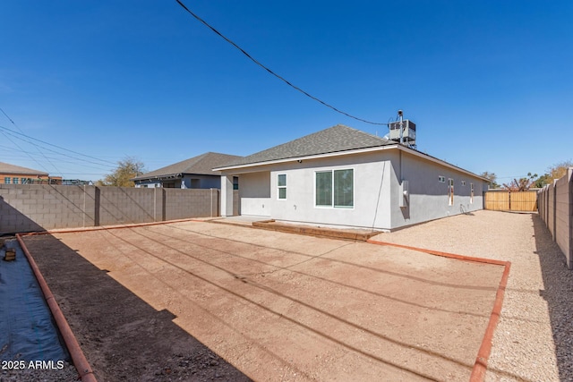 2227 W Cambridge Ave, Phoenix, AZ 85009 - rear view of property with a fenced backyard, stucco siding, roof with shingles, a patio area, and cooling unit