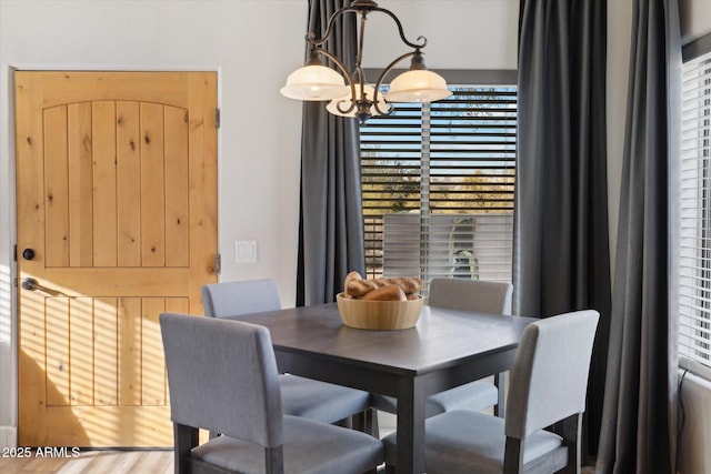 dining room featuring a notable chandelier