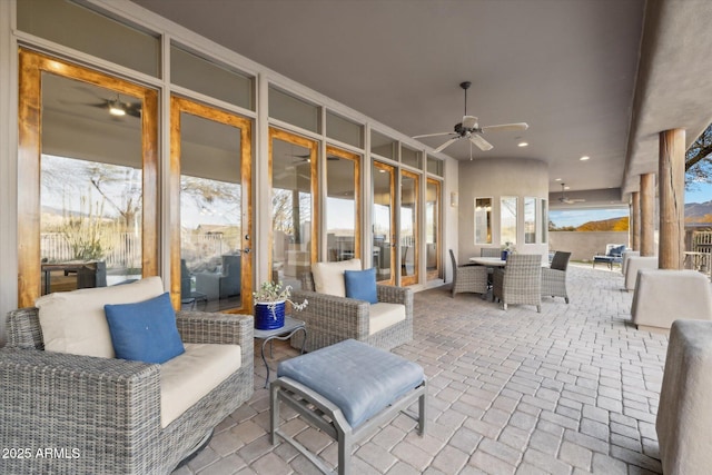 view of patio featuring an outdoor hangout area and ceiling fan