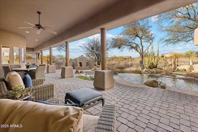 view of patio with ceiling fan and exterior kitchen