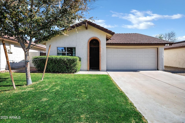 view of front of home with a garage and a front lawn