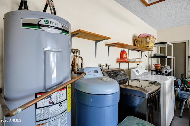 utilities with washer and clothes dryer and electric water heater