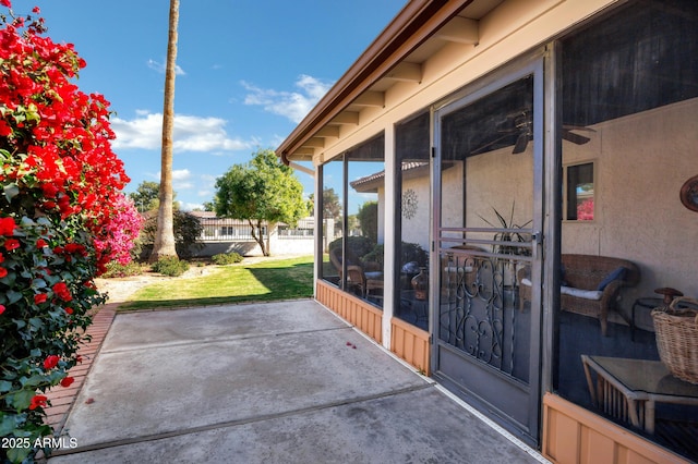 view of patio / terrace featuring a sunroom