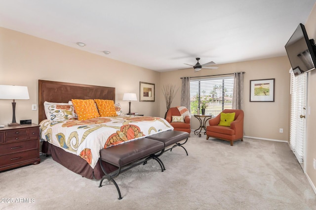 bedroom featuring baseboards, light carpet, and a ceiling fan