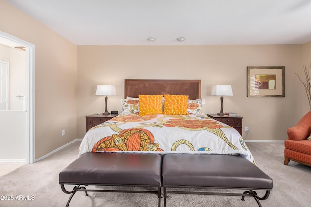 carpeted bedroom featuring baseboards