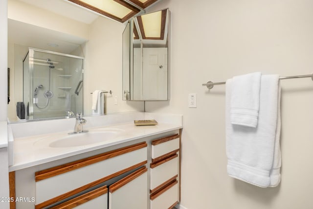 full bath featuring vanity and a shower stall