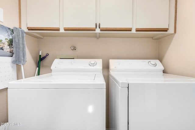 laundry room featuring cabinet space and independent washer and dryer